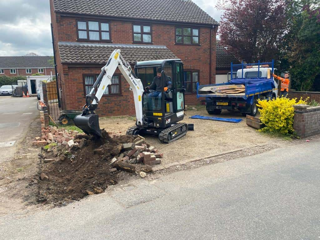 This is a photo of an operative of Great Yarmouth Driveways Digging out for a new tarmac driveway